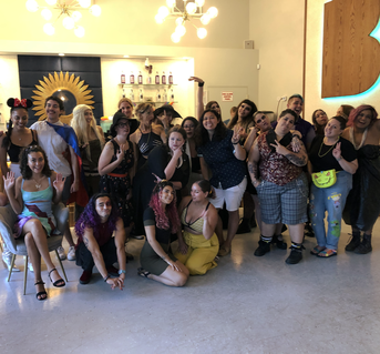 LGBTQIA+ group at Better Man Distilling, smiling and laughing